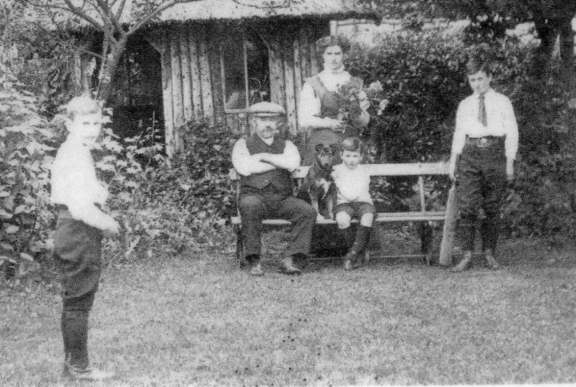 George Bentley and family in the back garden of Magnolia Cottage