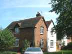 The 'pair of brick and tiled cottages'