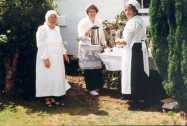 Preparing the tea in front of Beech House and the Shop