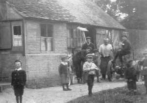 Children at the Forge - in their dinner hour, or in their Sunday best?