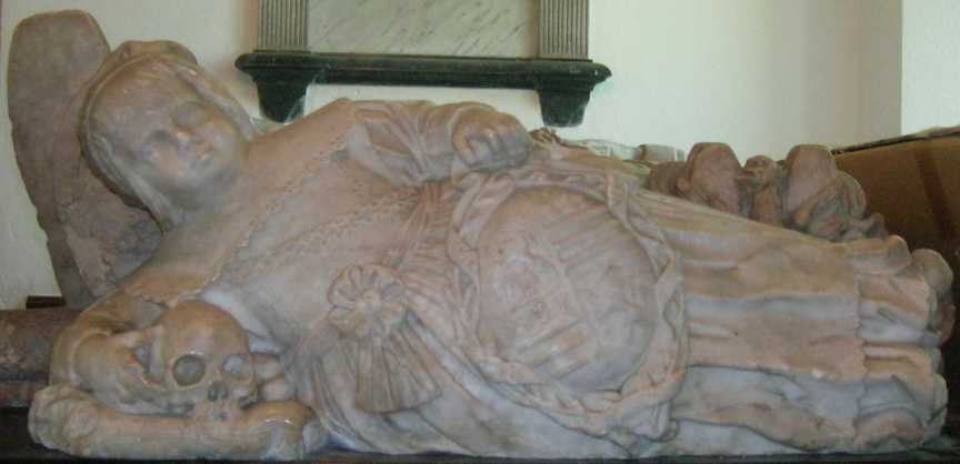 The child at the foot of William and Mary Standen - the skull's eye sockets fascinate small children