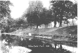 The River Loddon in the Arborfield Hall Estate, with the Hall visible behind the trees