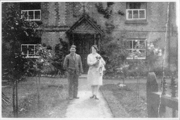 George Bentley and his wife in front of Magnolia Cottage