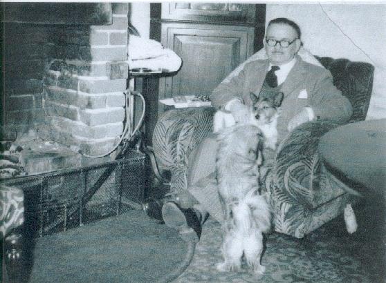 George Bentley beside his fireplace at Magnolia Cottage.