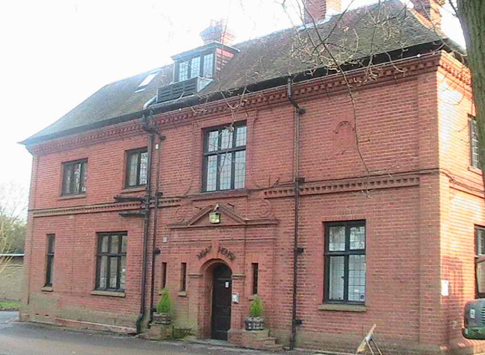 The front of the 'Moat House' with a plaque showing the date '1906'