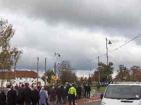 The procession reaches the roundabout by the Bull