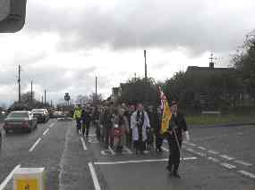 The procession reaches the brow of the hill, having just left the British Legion
