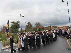 The procession re-forms and traffic is halted again