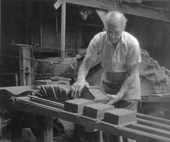 Arthur Bishop, forming a brick by hand