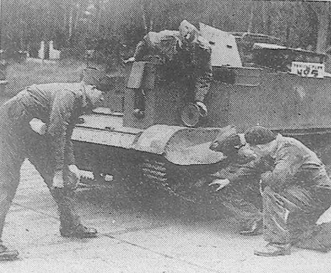 An Army Cadet force being shown repairs to a Bren carrier 
