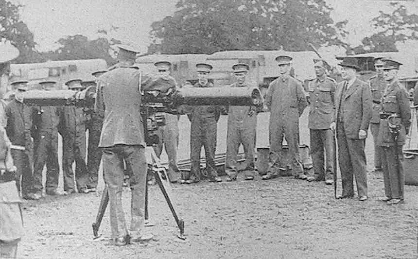 'Mr. Hore-Belisha watching a demonstration with a range-finder'