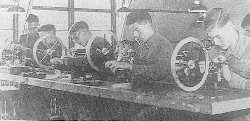 'Boys of the Army Technical School, Berkshire, being trained in watch-makers’ lathe work. They are taught to turn out precision instruments'