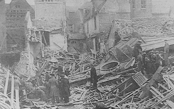 'A.R.P. Personnel and soldiers searching for victims amongst the ruins of a British Restaurant, destroyed in a raid on a Home Counties Town'