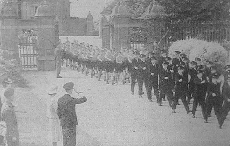 His Majesty taking the salute at the march past of the boys