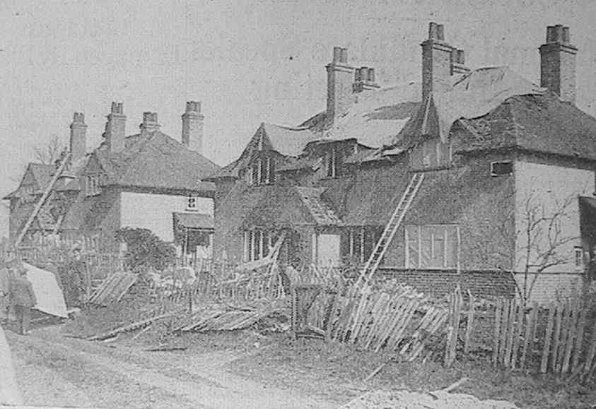 'Shortly after a V-Bomb dropped in a rural area of Southern England, workmen were busy repairing these cottages damaged by blast'